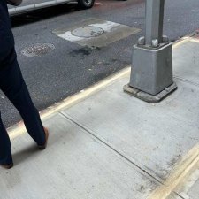 Smooth new concrete around a lamp post base